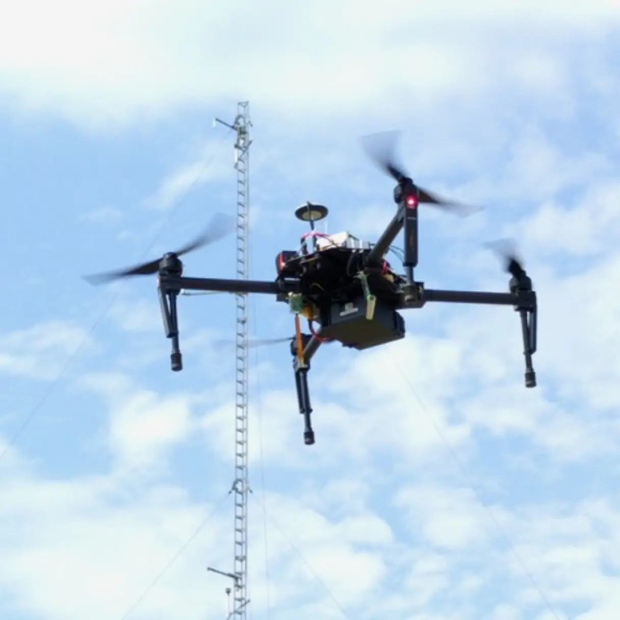 Drone flying with a Sparvio system mounted on.